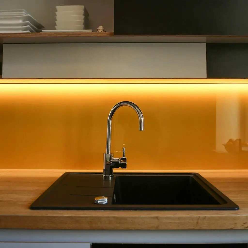 Kitchen sink with under-the-cabinet LED stripe orange light, lumens for kitchen task